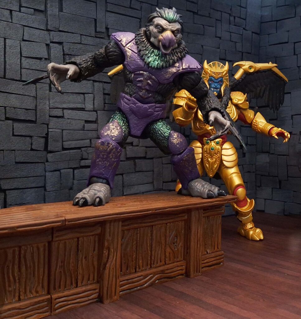 Tenga Warrior standing on a bar table with wings spread while Goldar encourages him inside The Nexus Dive bar