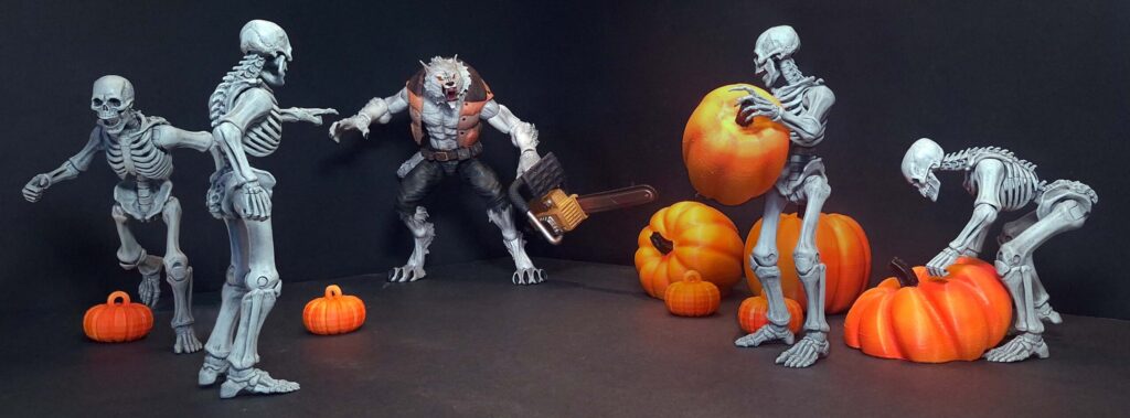 Toy photography horror scene with a werewolf holding a chainsaw confronting skeletons stealing pumpkins at night